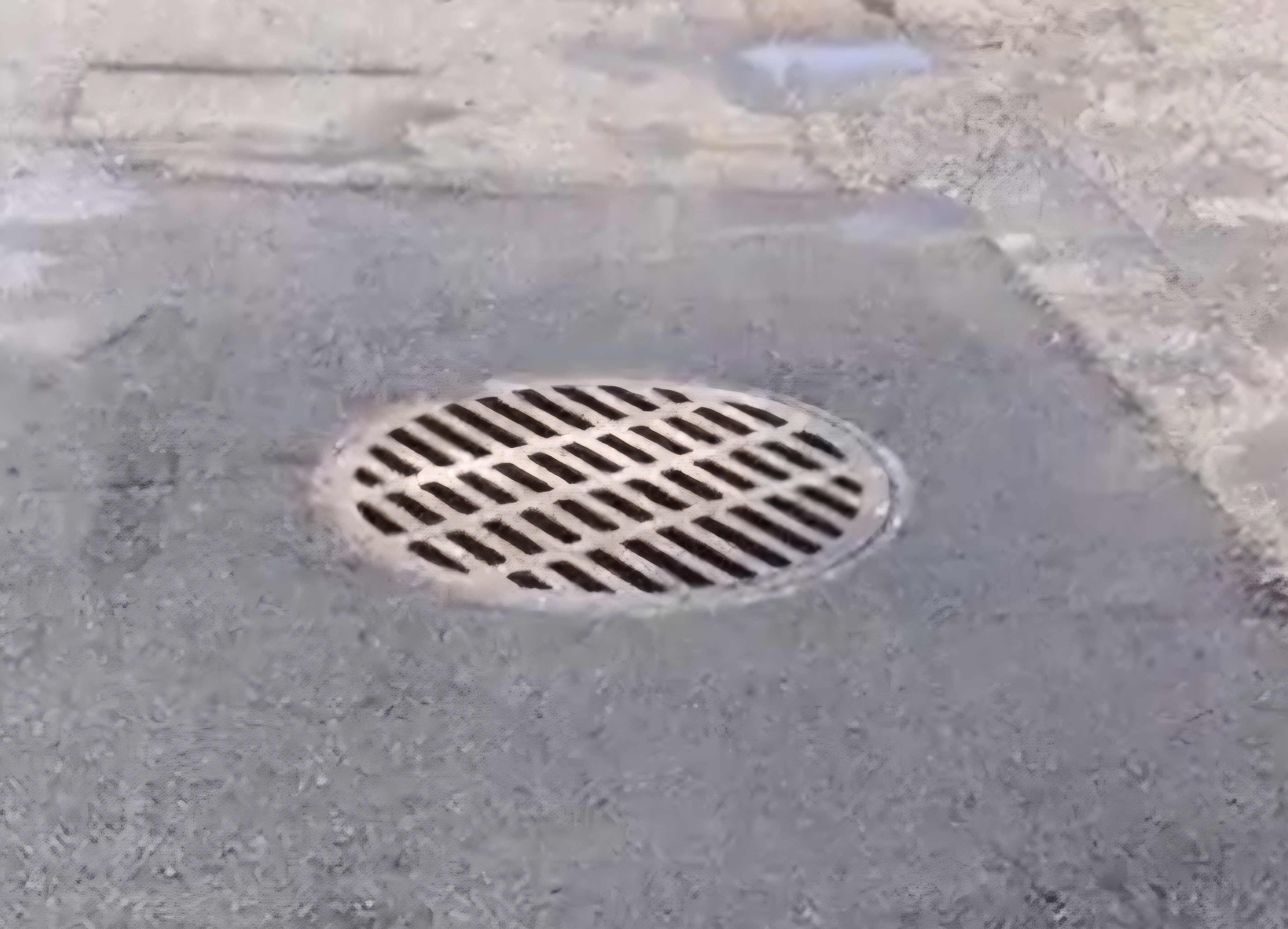 Precision saw-cut patch area around sewer grate